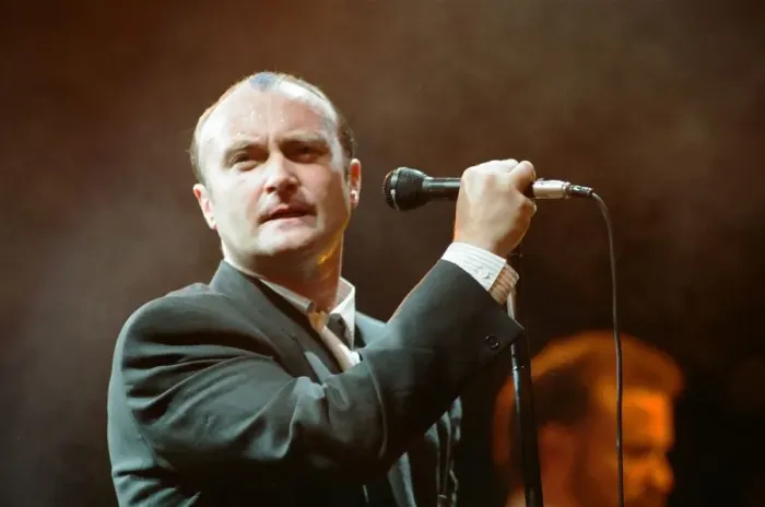 Framed Print : British singer Phil Collins performing on stage during a concert in Britain