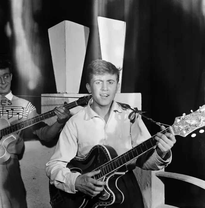 Framed Print : British singer Terry Dene playing guitar as he performs on stage at a Derby theatre Framed Print : British singer Terry Dene playing guitar as he performs on stage at a Derby theatre