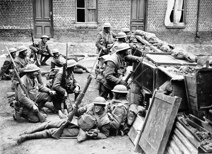 Framed Print : British soldiers take cover behind a barricade in Bailleul in anticipation Framed Print : British soldiers take cover behind a barricade in Bailleul in anticipation