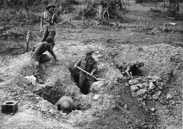 : British soldiers dig defences at the village of Hottot near Tilly Surseulles. WW2 1944 : British soldiers dig defences at the village of Hottot near Tilly Surseulles. WW2 1944
