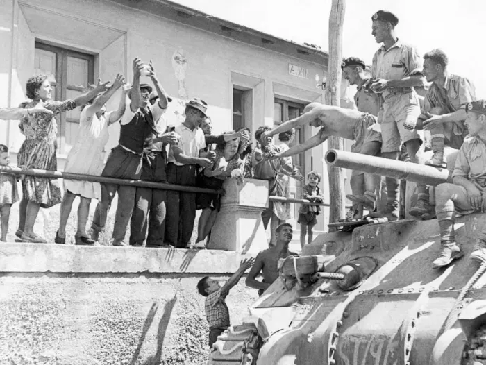 Framed Print : British soldiers greeted by local villagers during the Allied invasion Framed Print : British soldiers greeted by local villagers during the Allied invasion