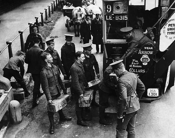 British soldiers loading ammunition onto motor bus in Londons Hyde Park during World War