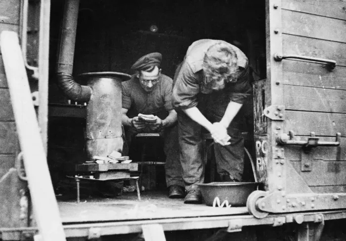 Framed Print : British soldiers in their makeshift home; Sapper Remington spends his spare time in a Framed Print : British soldiers in their makeshift home; Sapper Remington spends his spare time in a