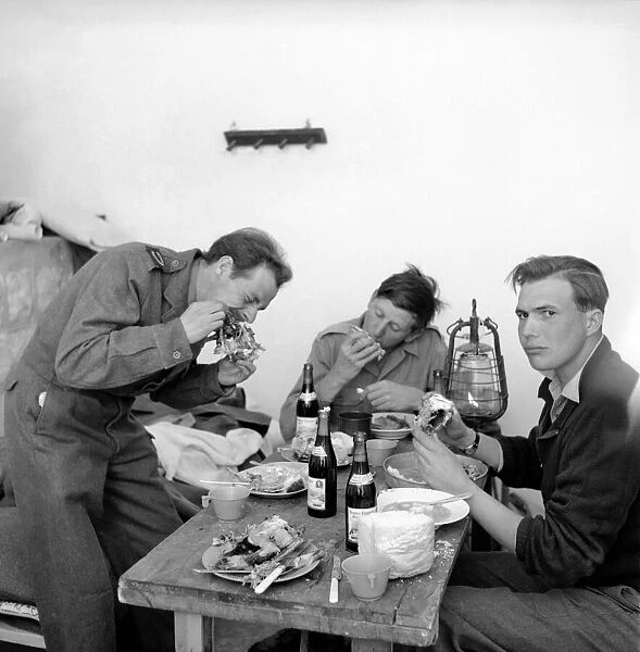 British soldiers in Trans Jordan seen here tucking into a lunch. March 1952 C1289-001
