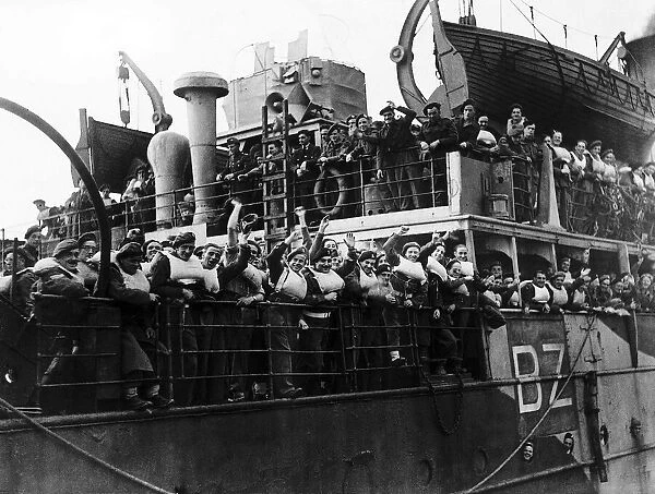British soldiers wave from troop ship returning to England from Calais after a long spell