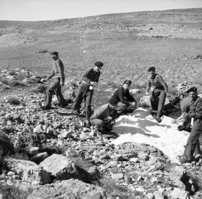 Framed Print : British soldiers on the way back from Wadi Pouse stop for a snowfall fight in Jordan