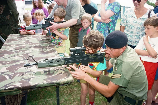 The British Steel Gala, Teesside. Children being shown how to use army rifles
