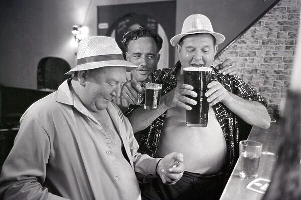 British tourists enjoying a litre of beer whilst on holiday in Spain June 1965