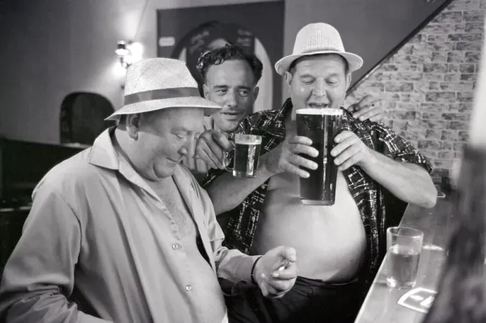 Framed Print : British tourists enjoying a litre of beer whilst on holiday in Spain June 1965 Framed Print : British tourists enjoying a litre of beer whilst on holiday in Spain June 1965