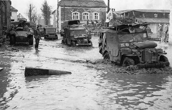 British transport passing through the flooded roads of Cranen-Bure