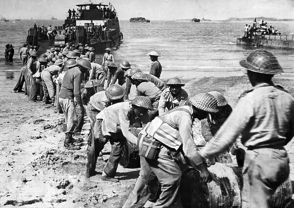 British troops of the 15th Indian Corps landing on Ramree Island. Supplies come ashore