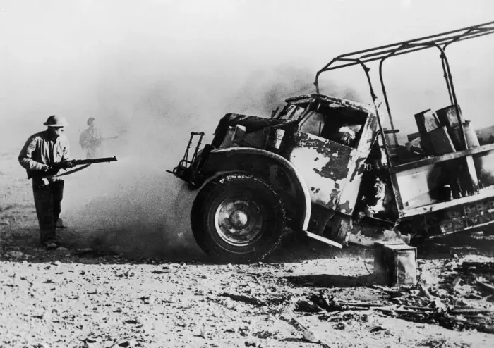 Framed Print : British troops approaching a burning enemy supply truck which along with the supply Framed Print : British troops approaching a burning enemy supply truck which along with the supply