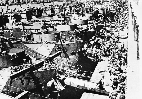 British troops boarding invasion craft at Catania, Sicily. 5th September 1943