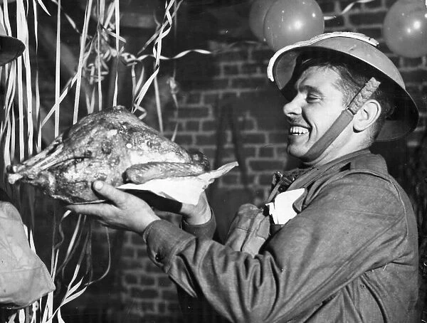British troops celebrating Christmas in France. Pictured inspecting the turkey before