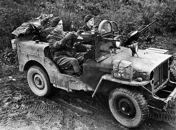 British troops drive into Germany. A jeep manned by Sergeant A Schofield
