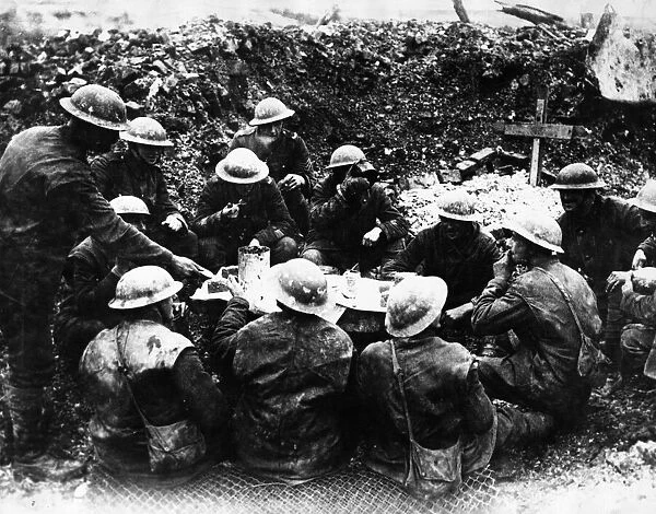 British Troops eating their Christmas Dinner in a shell hole at Beaumont Hamel