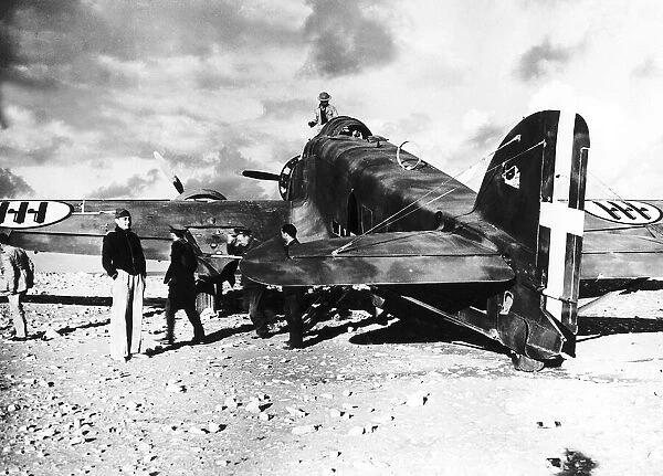 British troops examine the wreckage of an Italian S79 aircraft which landed on the edge