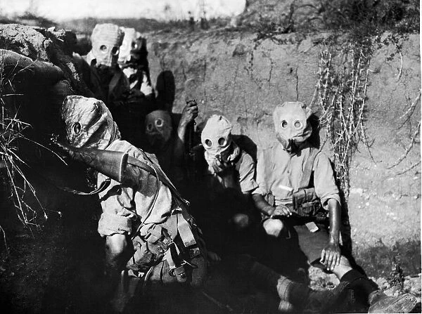 British troops of the Irish 10th Division seen here wearing gas masks in the trenches in