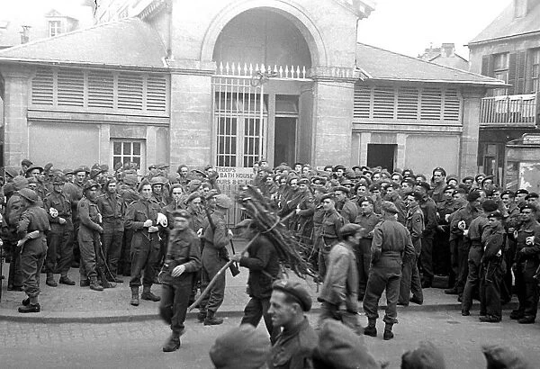 British troops outside the bath house in a Normandy town in Northern France shor
