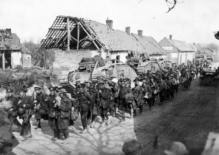 Framed Print : British troops passing tanks in a French village close to Amiens following the German