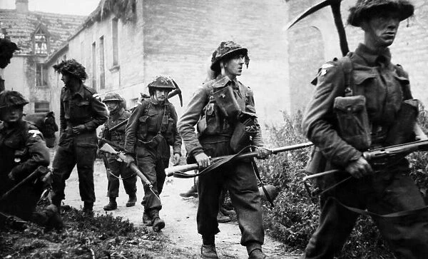British troops petrol the village of Mauvieu for emery elements. 29th June 1944