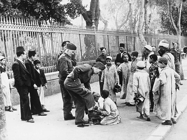British troops spend time with civilians in Central Cairo. 8th March 1942