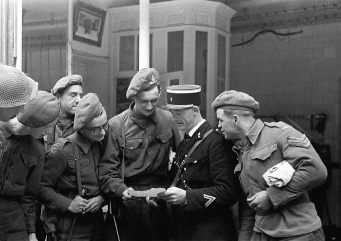 Framed Print : British troops talking to a local gendarme in a Normandy town in Northern France shortly Framed Print : British troops talking to a local gendarme in a Normandy town in Northern France shortly