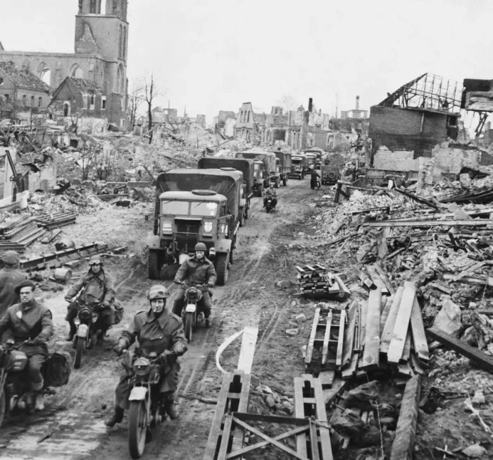 Framed Print : British troops and transport moving through the cleared streets of Stadtlohn, Germany Framed Print : British troops and transport moving through the cleared streets of Stadtlohn, Germany