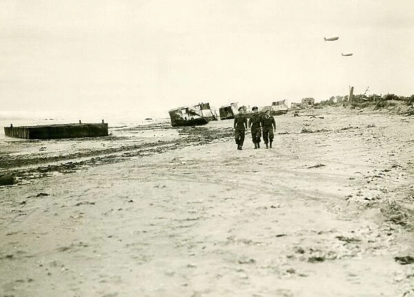 British troops walk along the beach in Normandy after the allied force had landed back in