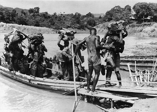 British and West Africans take Burma Village. Picture shows supplies coming ashore