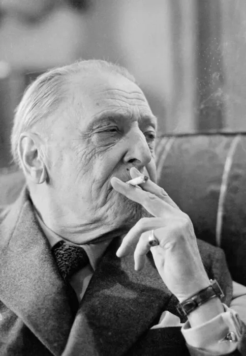 Framed Print : British writer William Somerset Maugham photographed smoking a cigarette at his home Framed Print : British writer William Somerset Maugham photographed smoking a cigarette at his home