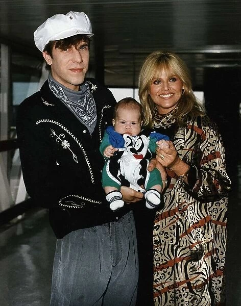 Britt Ekland with her husband Slim Jim McDonald and baby son Tom arrive at Heathrow