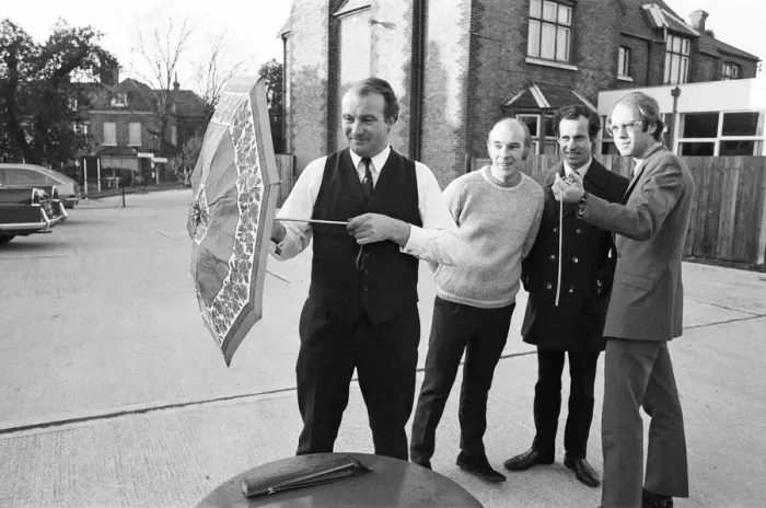 Framed Print : The Brolley Challenger - Jim Carver, of Orpington, taking an umbrella out of a case Framed Print : The Brolley Challenger - Jim Carver, of Orpington, taking an umbrella out of a case