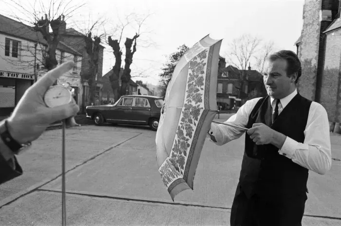 Framed Print : The Brolley Challenger - Jim Carver, of Orpington, taking an umbrella out of a case Framed Print : The Brolley Challenger - Jim Carver, of Orpington, taking an umbrella out of a case