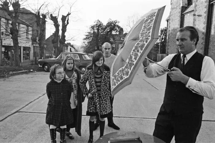 Framed Print : The Brolley Challenger - Jim Carver, of Orpington, taking an umbrella out of a case Framed Print : The Brolley Challenger - Jim Carver, of Orpington, taking an umbrella out of a case