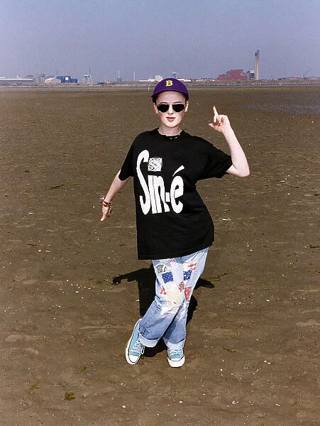 Bronagh Gallagher Actress in the film The Commitments standing on beach in black t shirt