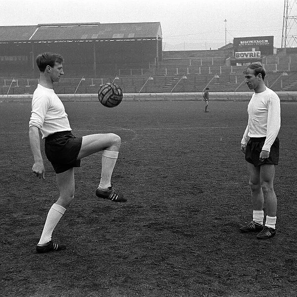 Brothers Jack and Bobby Charlton in training in an empty stadium April 1965