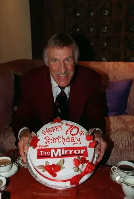 : Bruce Forsyth TV Presenter February 98 Holding a birthday cake given to him by : Bruce Forsyth TV Presenter February 98 Holding a birthday cake given to him by