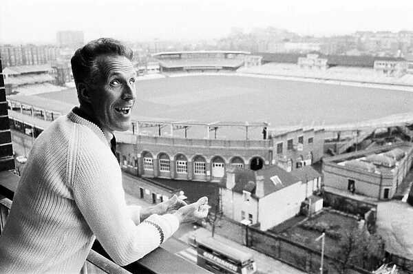 Bruce Forsythe Entertainer, July 1965 looking over the balcony of his flat which