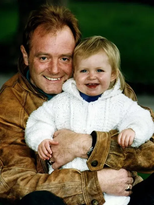 Framed Print : Bruce Jones milkman and actor the star of Raining Stones with his granddaughter Sophie