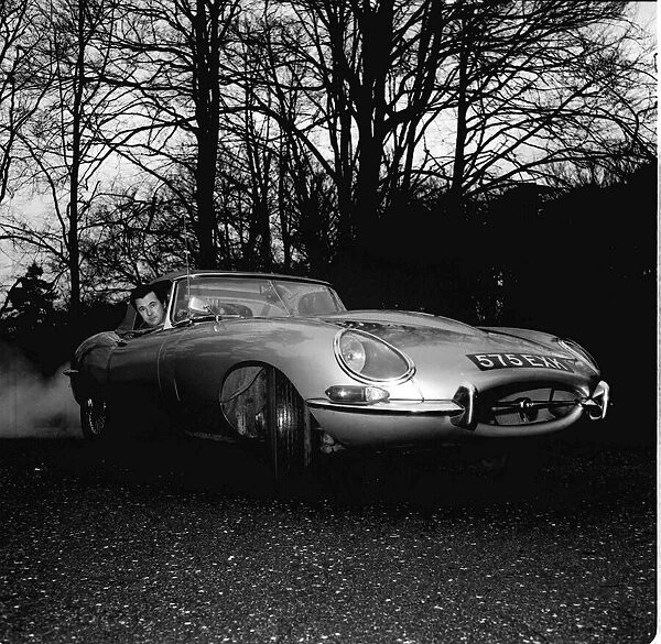Bryan Forbes January 1964 in his E-type Jaguar