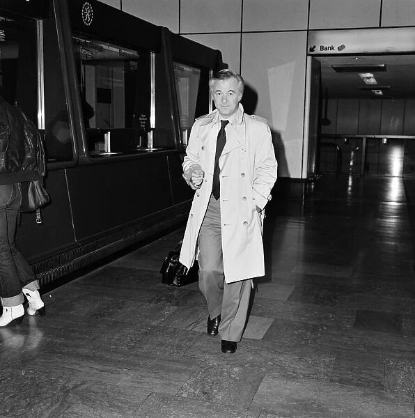 Bryan Forbes leaving Heathrow Airport for Paris. 4th March 1980