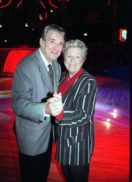 Bryan Mosley actor December 1998 dancing with wife Norma at a Christmas Party