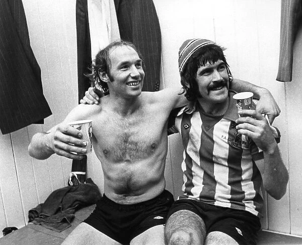 Bryan Robson (left) & Billy Hughes Sunderland football players celebrate in changing room