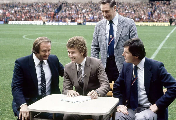 Bryan Robson signs for Manchester United with Ron Atkinson looking