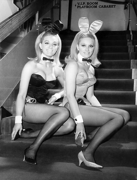 Bunny girls sitting on the steps inside the nightclub where they work
