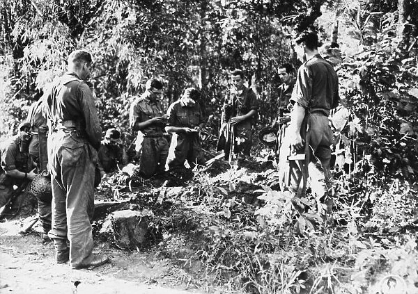Burial of British soldier killed by Japanese sniper in a service held by Fr. H. E. Ralph