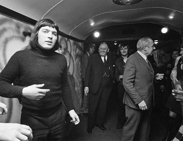 Burnley fans aboard the disco train to London. Chairman Bob Lord is pictured with fans