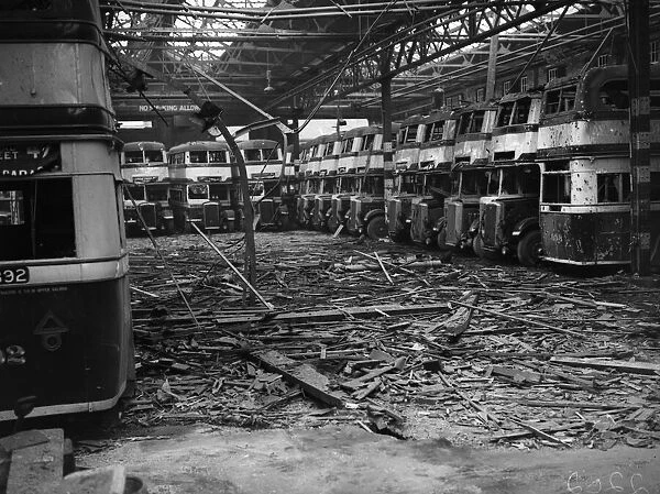 Burnt out buses and debris strewn across the floor of the Highgate Road Bus Garage