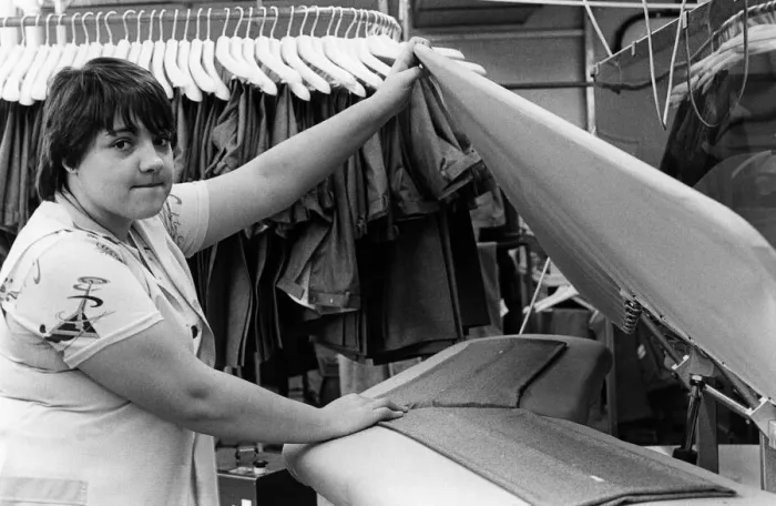 Framed Print : Burtons menswear factory in Guisborough. An employee ensuring a sharp crease Framed Print : Burtons menswear factory in Guisborough. An employee ensuring a sharp crease